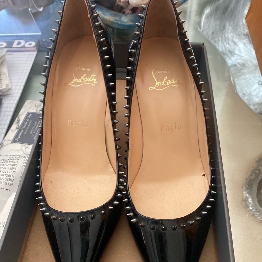 Christian Louboutin black with spikes red bottoms